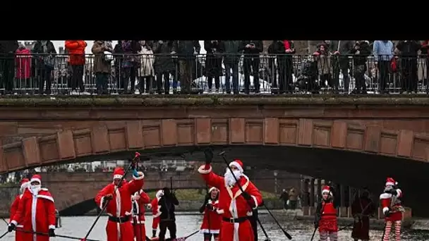 Des pères Noël naviguent en paddle à Strasbourg