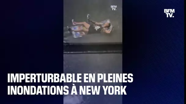 Inondations à New York: imperturbable, un homme continue de fumer sa chicha sur un matelas gonflable