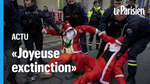 « Joyeuse extinction ! » : Des faux Pères Noël d’Extinction Rebellion manifestent devant le ministèr